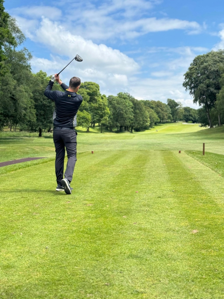 Golfer from back putting