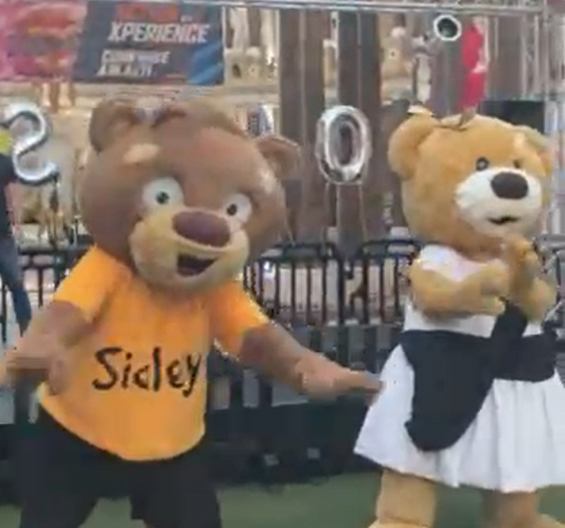 Sidley and Maximus mascots dancing