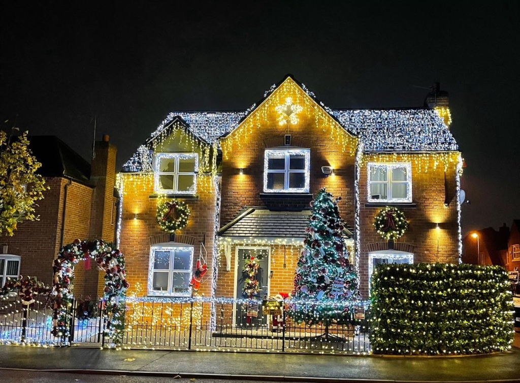 A house brightly decorated with lights